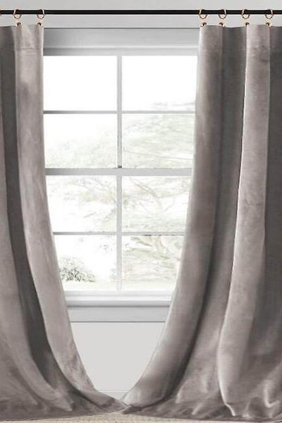 How can velvet curtains be used to control the amount of natural light in a room